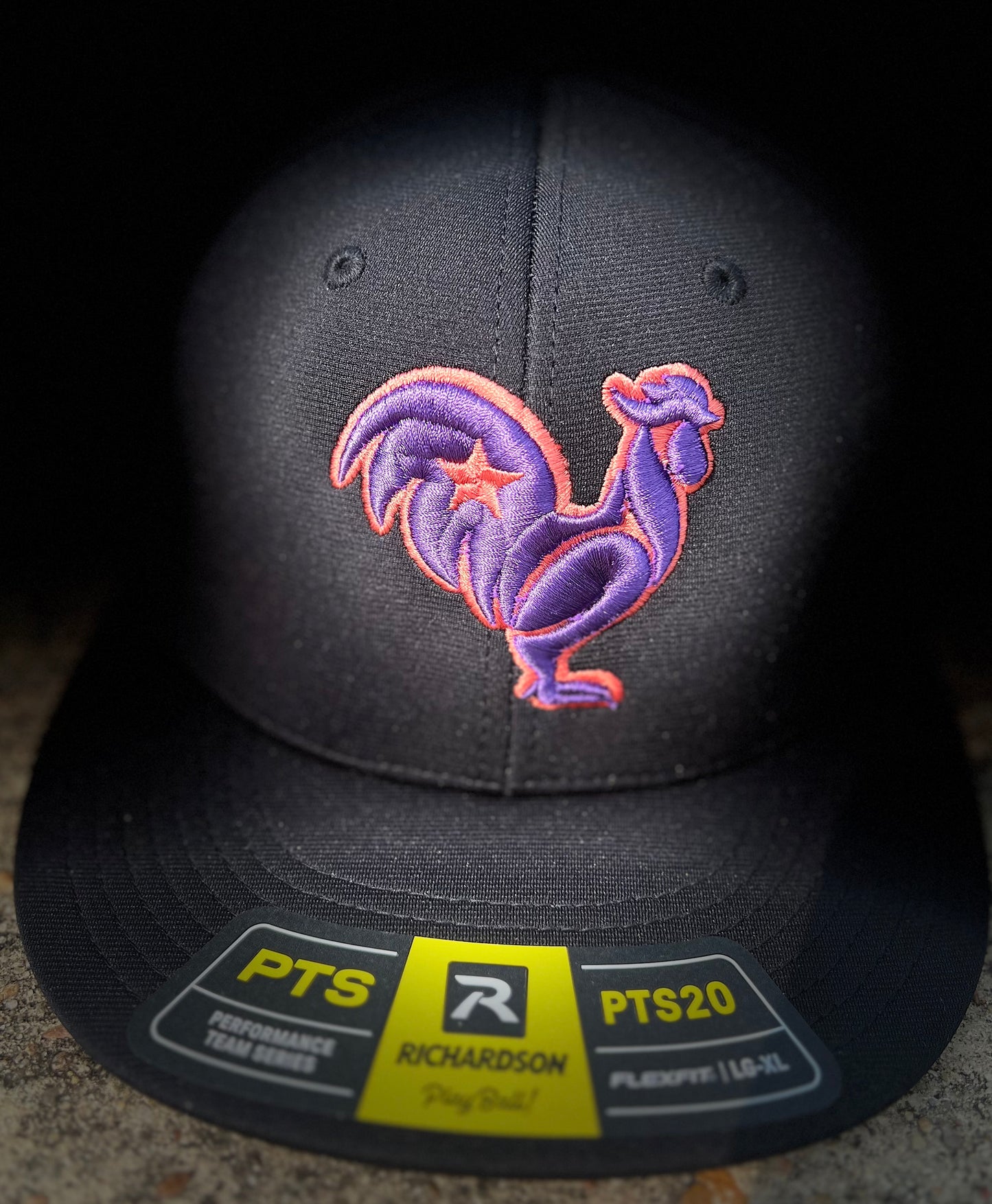 Black hat with purple rooster, orange outline & orange star