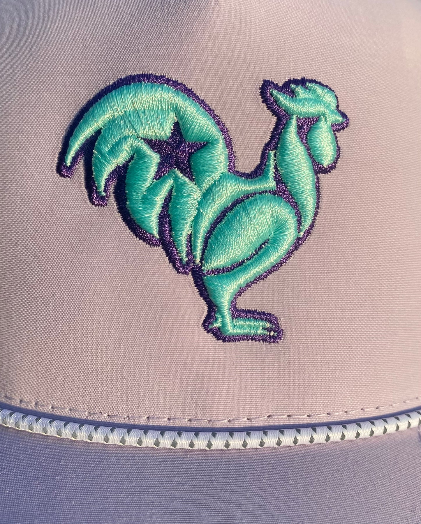 Teal rooster with purple outline & purple star on Liliac Snapback