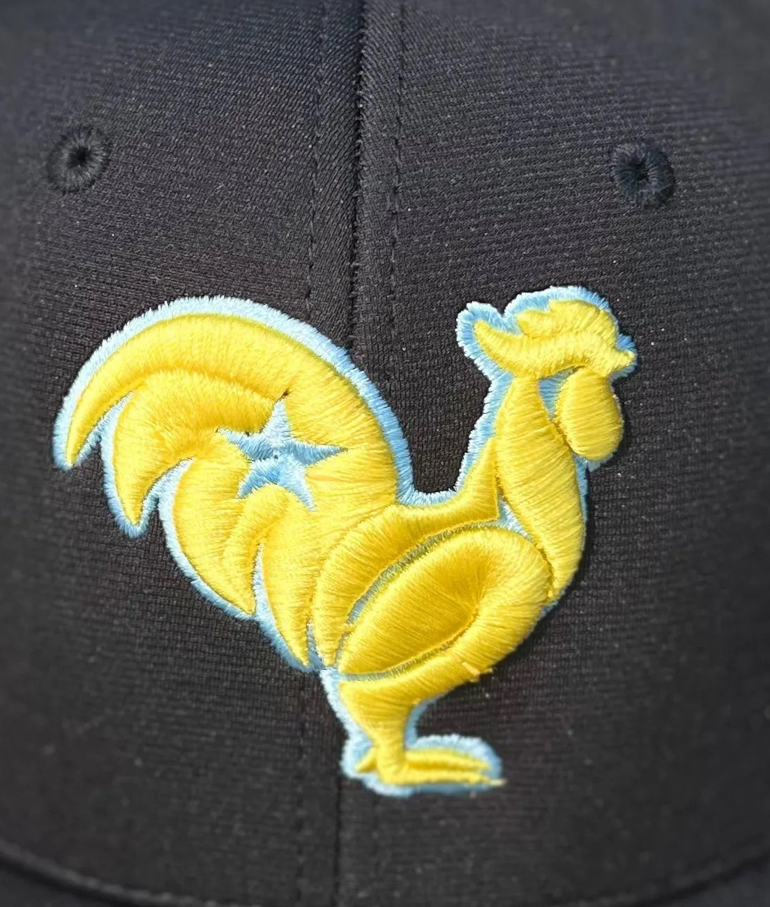 Black hat with yellow rooster blue star