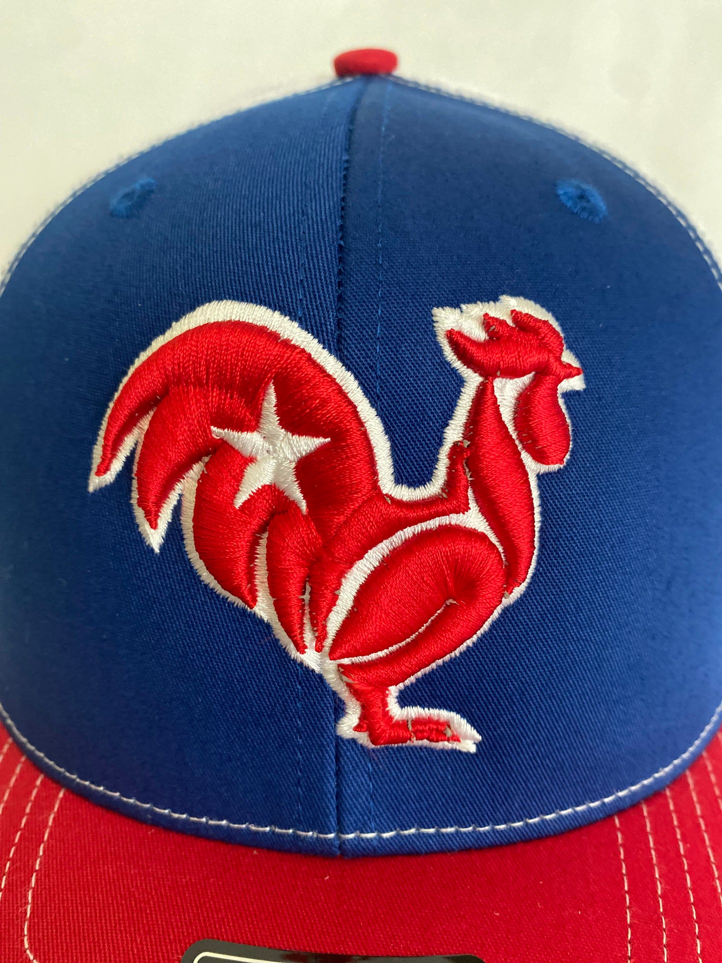 Red with white star on royal blue Snapback