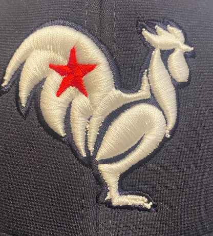 White rooster with red star, navy hat