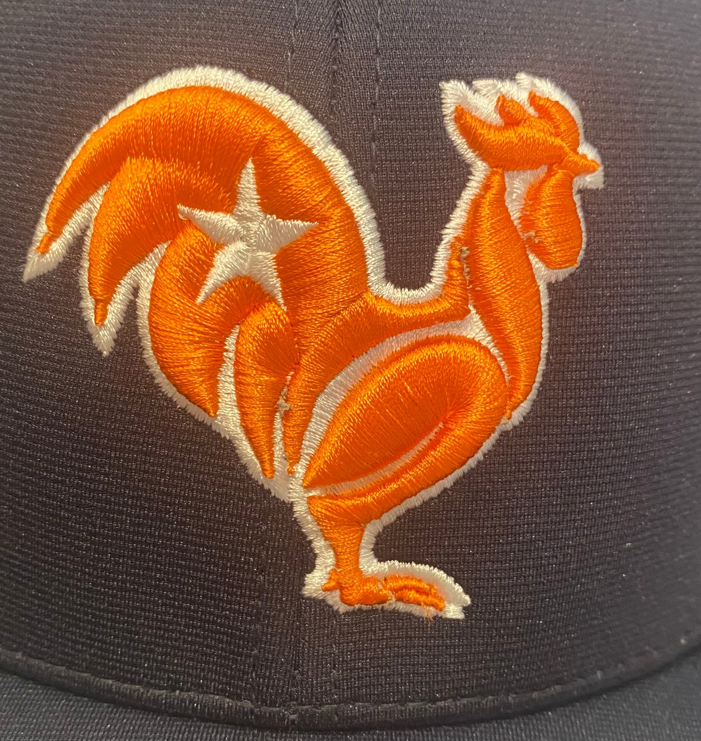 Orange rooster with white outline & star, navy hat